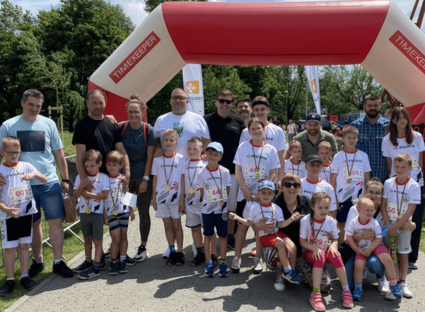 Parents and children ready to take part in a colorful sock fun run